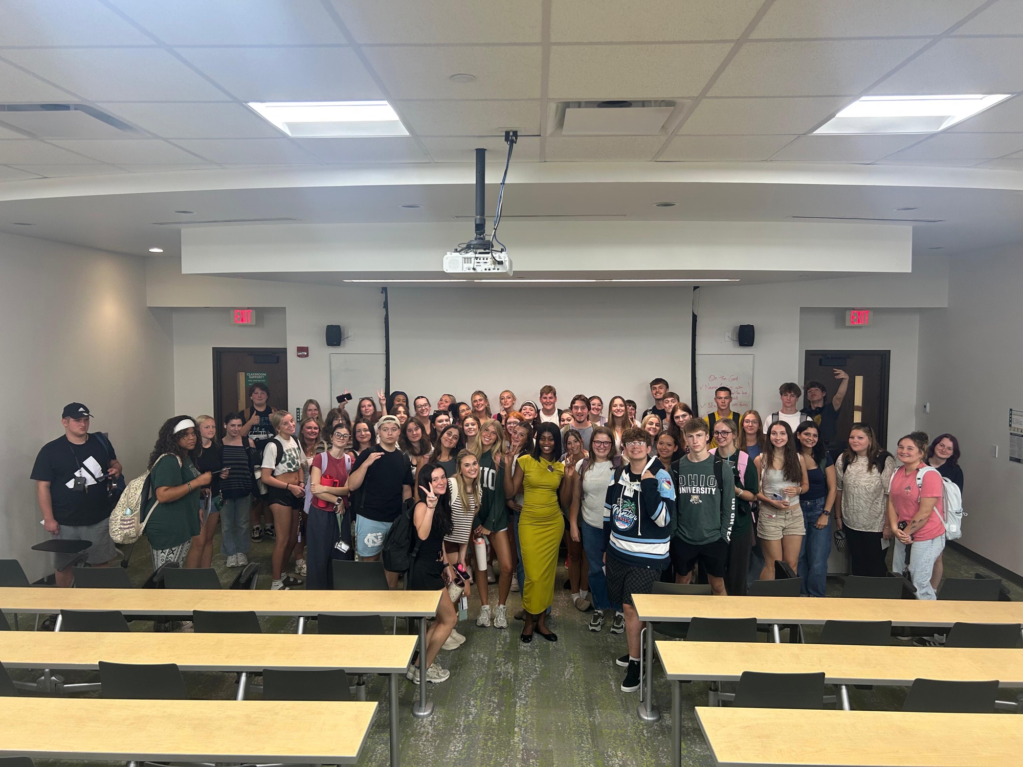 Christabel and her students smiling together after class